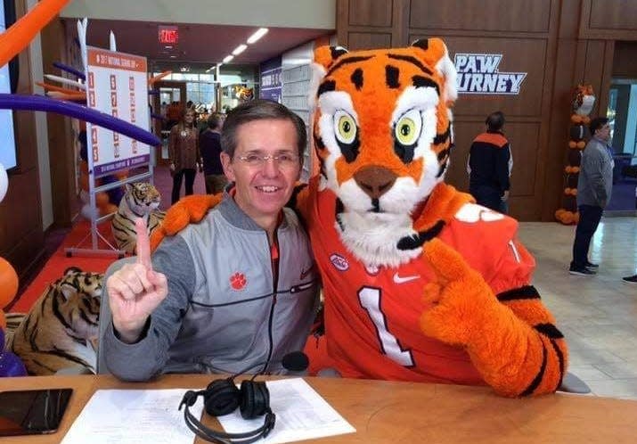 The Vloice of the Tigers Don Munson poses with the Tigers mascot during a recent event at Clemson, S.C.
