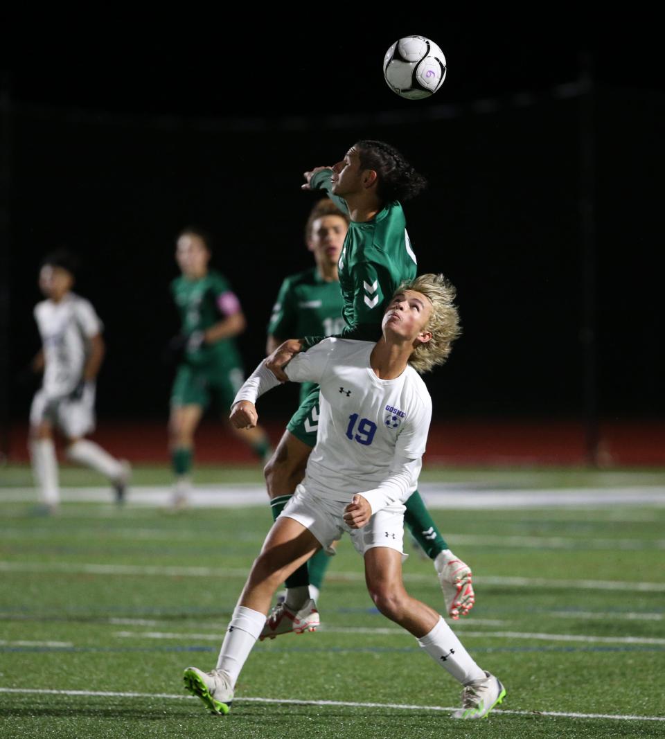 Cornwall's Griffin Harden wins a header over Goshen's Tad Kovacs during the Section 9 Class AA championship on October 30, 2023.