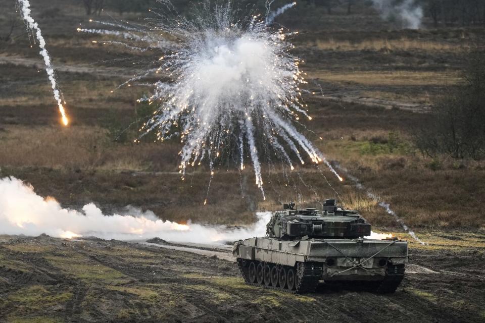 Smoke hovering over German Leopard 2 tank during military drill