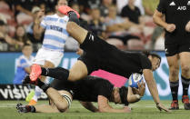 New Zealand's Caleb Clarke collides with teammate Scott Barrett as he catches the ball during the Tri-Nations rugby test between Argentina and the All Blacks in Newcastle, Australia, Saturday, Nov. 28, 2020. (AP Photo/Rick Rycroft)