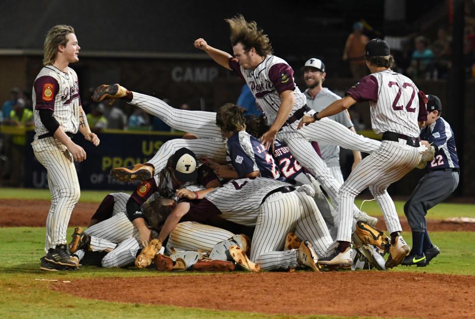 Troy, Alabama, players celebrate after winning the 2022 American Legion World Series on Tuesday, August 17, 2022, at Keever Stadium in Shelby, N.C. Post 70 defeated Idaho Falls, Idaho, 6-5 in the championship game.