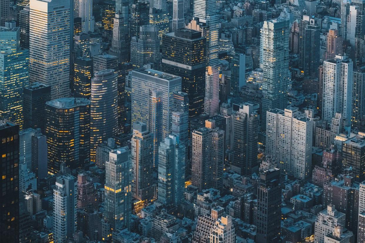 Insurers are facing rising costs from effects of climate change. <a href="https://www.gettyimages.com/detail/photo/aerial-view-of-new-york-city-skyline-at-night-royalty-free-image/1368629737" rel="nofollow noopener" target="_blank" data-ylk="slk:© Marco Bottigelli/Moments via Getty Imagse;elm:context_link;itc:0;sec:content-canvas" class="link ">© Marco Bottigelli/Moments via Getty Imagse</a>