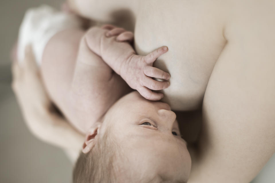 (GERMANY OUT) Woman suckling two week old baby.  (Photo by Classen/ullstein bild via Getty Images)