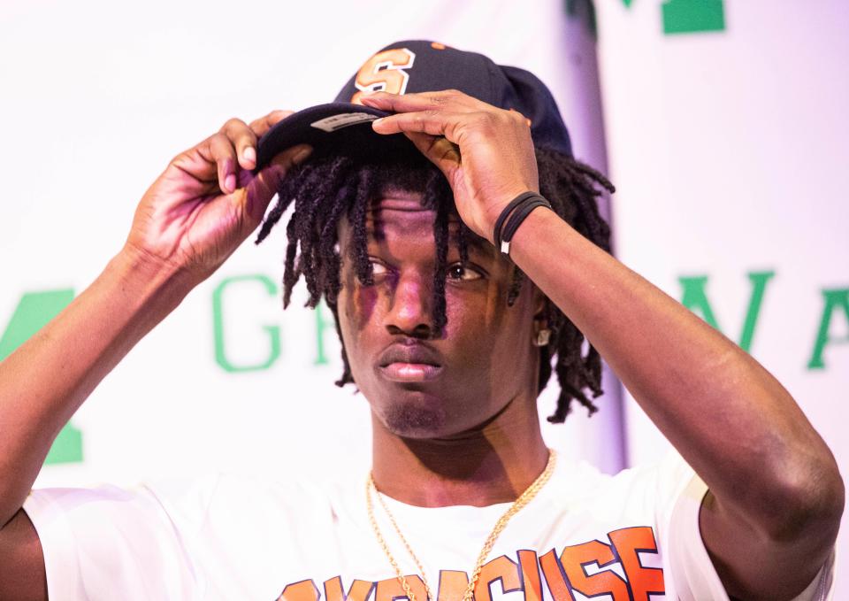 Fort Myers High School football player Greg Delaine signed a letter of intent to play football at Syracuse University on Wednesday Jan. 2, 2022.