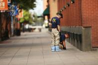 Members of an FBI evidence response team search an area that is still an active crime scene in downtown Dallas, Texas on July 9, 2016