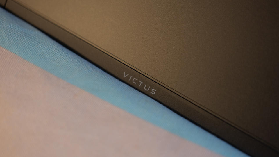 An HP Victus 15 laptop on a colourful table