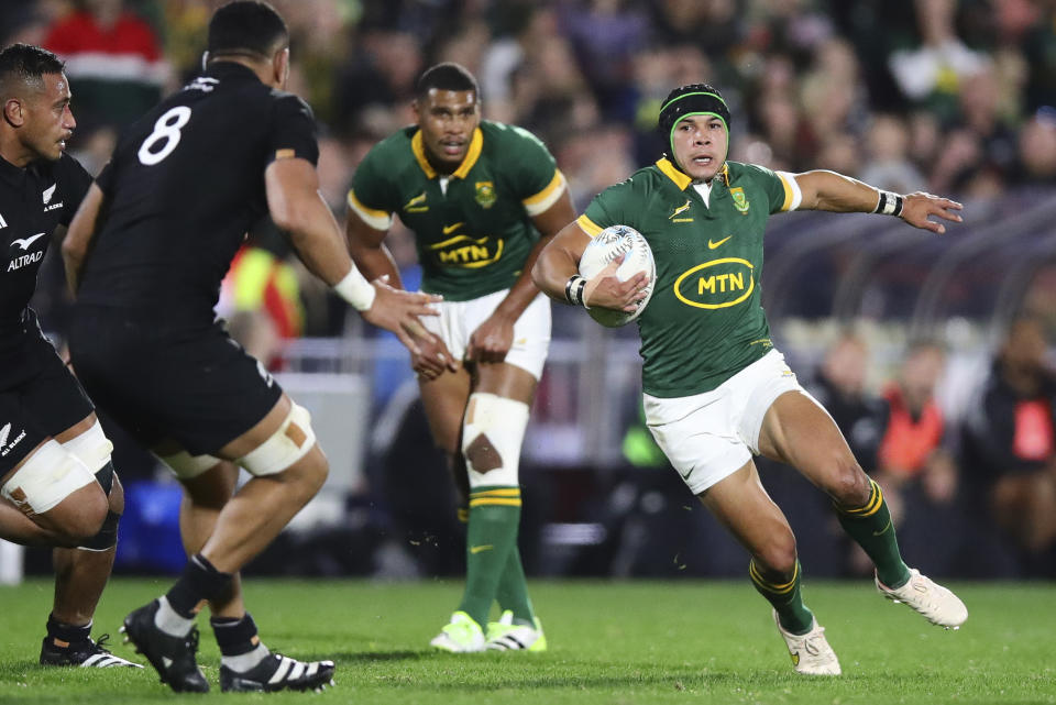 South Africa's Cheslin Kolbe runs at New Zealand's Ardie Savea during the Rugby Championship test match between the All Blacks and South Africa at Mt Smart Stadium in Auckland, New Zealand, Saturday, July 15, 2023. ( Aaron Gillions/Photosport via AP)