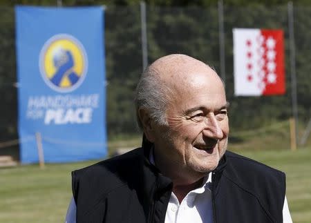 Sepp Blatter smiles in Blatter's home-town Ulrichen, Switzerland, August 22, 2015. REUTERS/Denis Balibouse