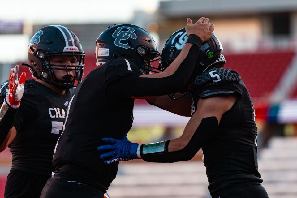 Corner Canyon High School’s Isaac Wilson, left, celebrates his touchdown with teammate Brayden Eyre during the 6A football state championship against Skyridge High School at Rice-Eccles Stadium in Salt Lake City on Friday, Nov. 17, 2023. | Megan Nielsen, Deseret News