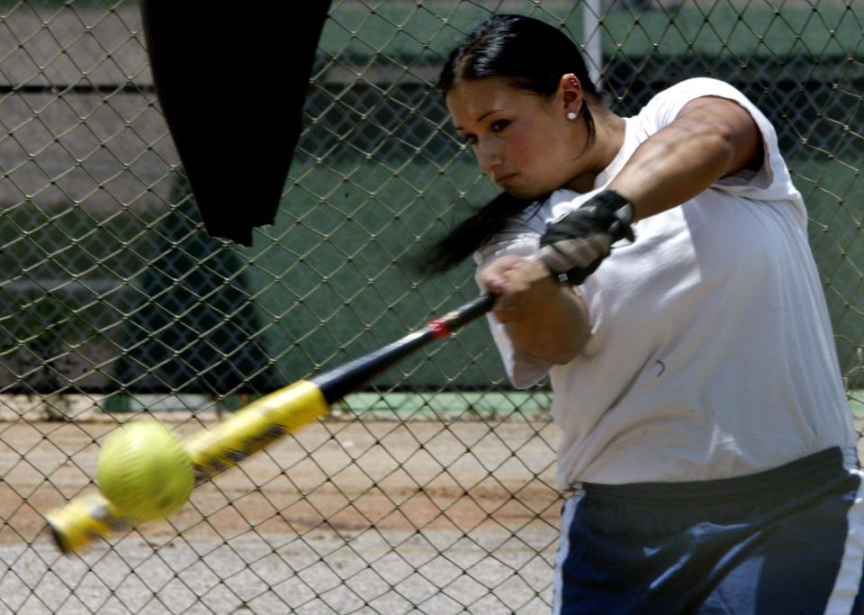 Michigan's Samantha Findlay keeps her eye on the ball as she hits in the batting cages during a team practice for the NCAA Women's College World Series in Oklahoma City, Wednesday, June 1, 2005. Michigan will face DePaul in game 3 of the tournament on Thursday.