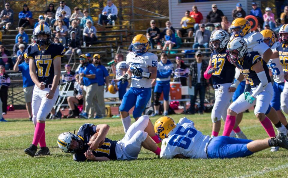 Erie Mason quarterback Vaughn Brown is sacked by Jefferson's Daniel Phipps during a 14-6 Mason win last season.