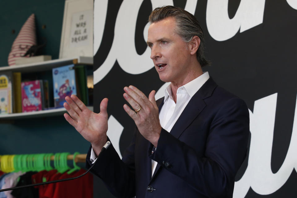 FILE - In this Tuesday, May 5, 2020, file photo California Gov. Gavin Newsom discusses his plan for the gradual reopening of California businesses during a news conference at the Display California store in Sacramento, Calif. Gov. Newsom said he could have communicated better with the public last year before the first loosening of coronavirus restrictions that led to an early summer spike in case, a moment the called a "gateway that we reflect upon all the time" as the nation's most populous state enters the second year of pandemic restrictions. (AP Photo/Rich Pedroncelli, Pool,File)