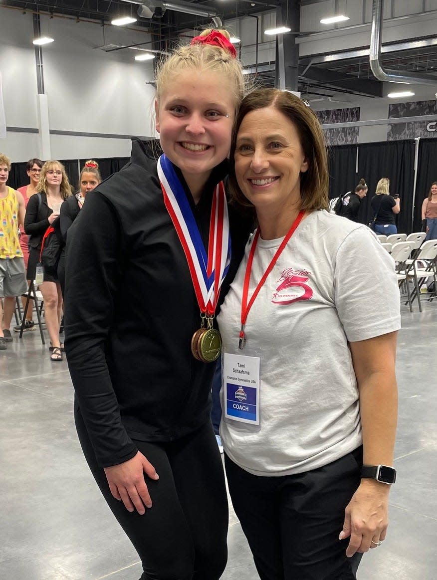 Sarah Moraw and Champion Gymnastics coach Tami Schaafsma.