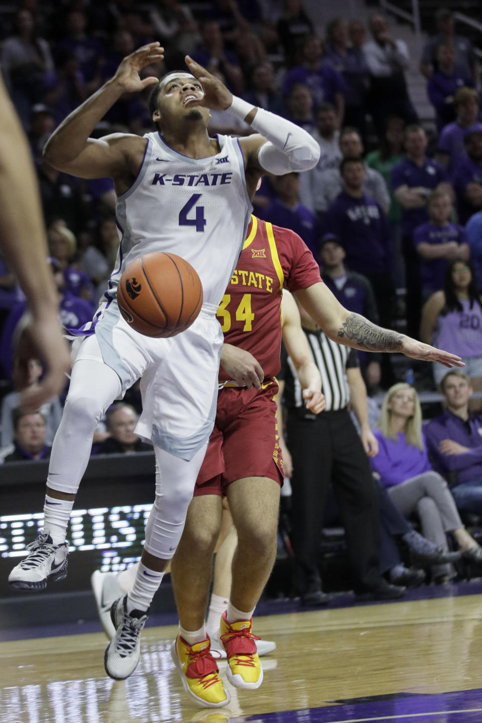 Kansas State guard David Sloan (4) is stripped of the ball by Iowa State guard Nate Jenkins (34) during the second half of an NCAA college basketball game in Manhattan, Kan., Saturday, March 7, 2020. (AP Photo/Orlin Wagner)