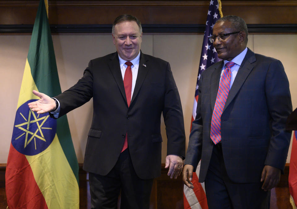 U.S. Secretary of State Mike Pompeo, left, takes part in a joint press conference with Ethiopian Foreign Minister Gedu Andargachew, at the Sheraton Hotel, in Addis Ababa, Ethiopia, Tuesday Feb. 18, 2020. America’s top diplomat in his final Africa stop has discussed political reforms with Ethiopia’s Nobel Peace Prize-winning prime minister, and Ethiopia says the U.S. plans to provide “substantial financial support.” (Andrew Caballero-Reynolds/Pool Photo via AP)