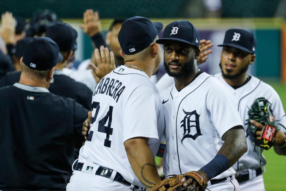 Detroit Tigers shortstop Niko Goodrum (28) celebrates with teammates after the Tigers' 1-0 win over Cleveland at Comerica Park in Detroit on Wednesday, May 26, 2021.