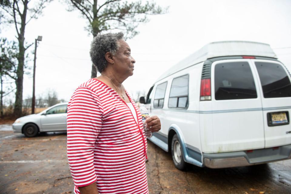 Jamelle McGhee talks with neighbors at the Union Academy Baptist Church in the Flatwood neighborhood in Montgomery, Ala., on Wednesday, Nov. 30, 2022. A tornado hit the area earlier in the morning. 