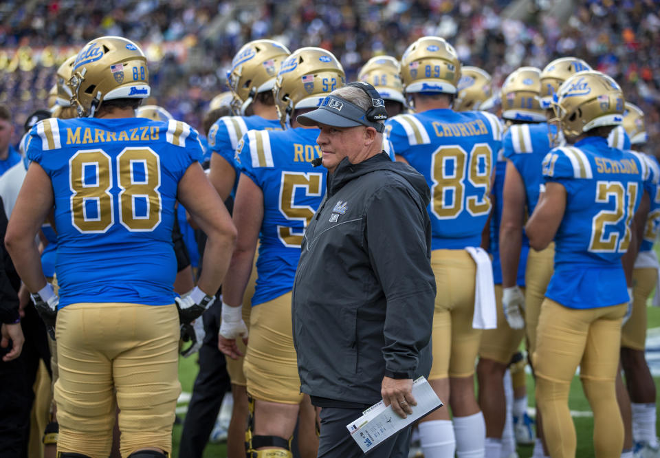 UCLA coach Chip Kelly walks back to the sideline during a timeout in the Sun Bowl against Pittsburgh on Dec. 30, 2022, in El Paso, Texas. (AP Photo/Andres Leighton)