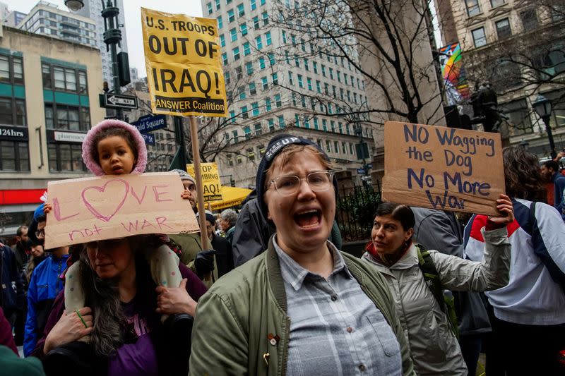 People march as they take part in an anti-war protest amid increased tensions between the United States and Iran at Times Square in New York