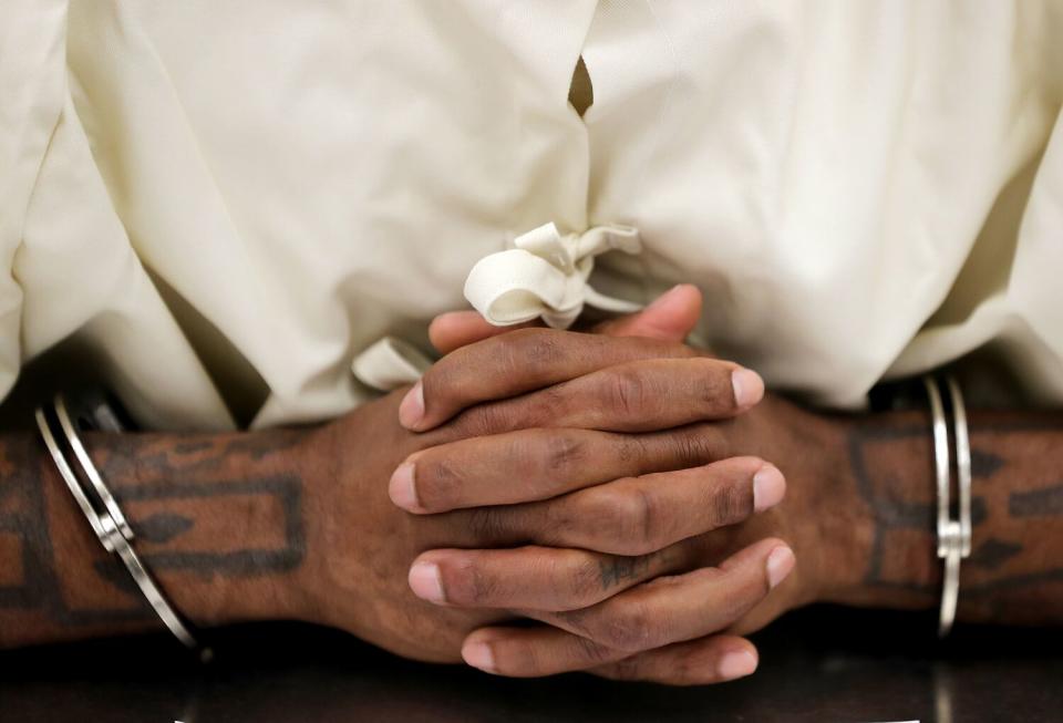 A prisoner is shackled while attending a class for mental health at California State Prison, Sacramento.