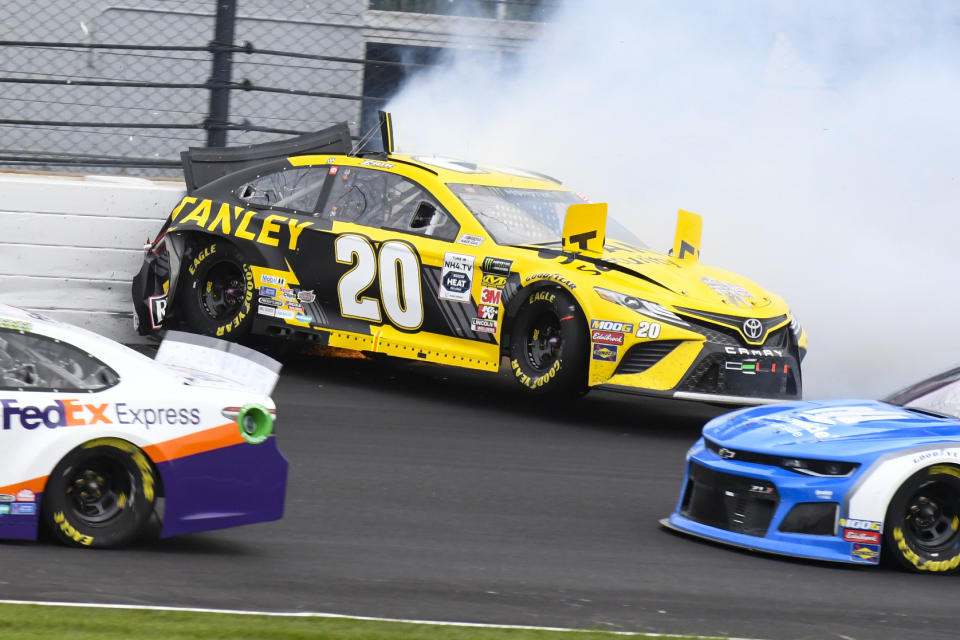 NASCAR driver Erik Jones hits the wall in the second turn during the NASCAR Brickyard 400 auto race at Indianapolis Motor Speedway, Sunday, Sept. 8, 2019, in Indianapolis. (AP Photo/Greg Huey)