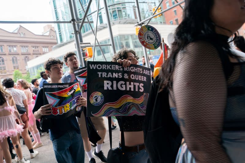 Starbucks workers attend a protest as part of a collective action over a Pride decor dispute, outside a Starbucks shop
