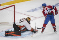 Montreal Canadiens' Laurent Dauphin, right, scores a penalty shot against Anaheim Ducks goaltender Anthony Stolarz, left, during third-period NHL hockey game action in Montreal, Thursday, Jan. 27, 2022. (Graham Hughes/The Canadian Press via AP)