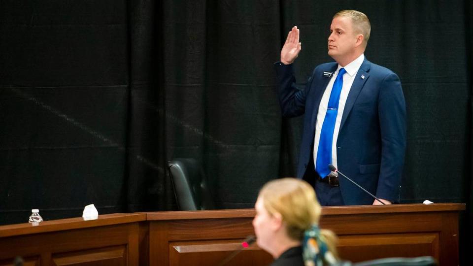 Rep. Aaron von Ehlinger, R-Lewiston, takes an oath before providing testimony before the Idaho Ethics and House Policy Committee regarding allegations of sexual misconduct Wednesday, April 28, 2021 in the Lincoln Auditorium at the Idaho Statehouse in Boise.