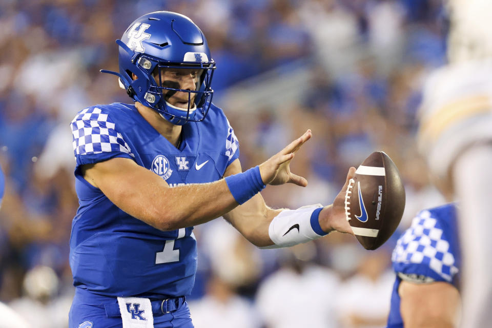 Kentucky quarterback Will Levis (7) takes the snap during the first half of an NCAA college football game against Missouri in Lexington, Ky., Saturday, Sept. 11, 2021. (AP Photo/Michael Clubb)