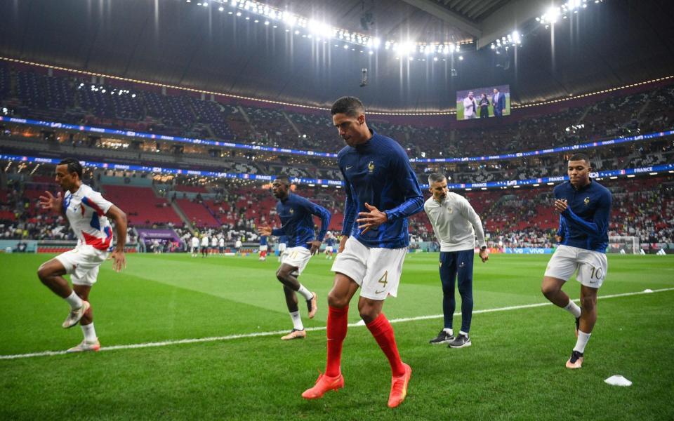 France's defender #05 Jules Kounde (L), forward #11 Ousmane Dembele (2nd L), defender #04 Raphael Varane (C) and forward #10 Kylian Mbappe - AFP