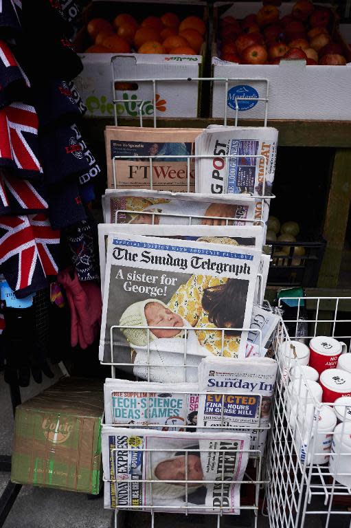 National newspapers display pictures of the new daughter of Britain's Prince William and wife Kate on their front covers in a newsagents in London on May 3, 2015