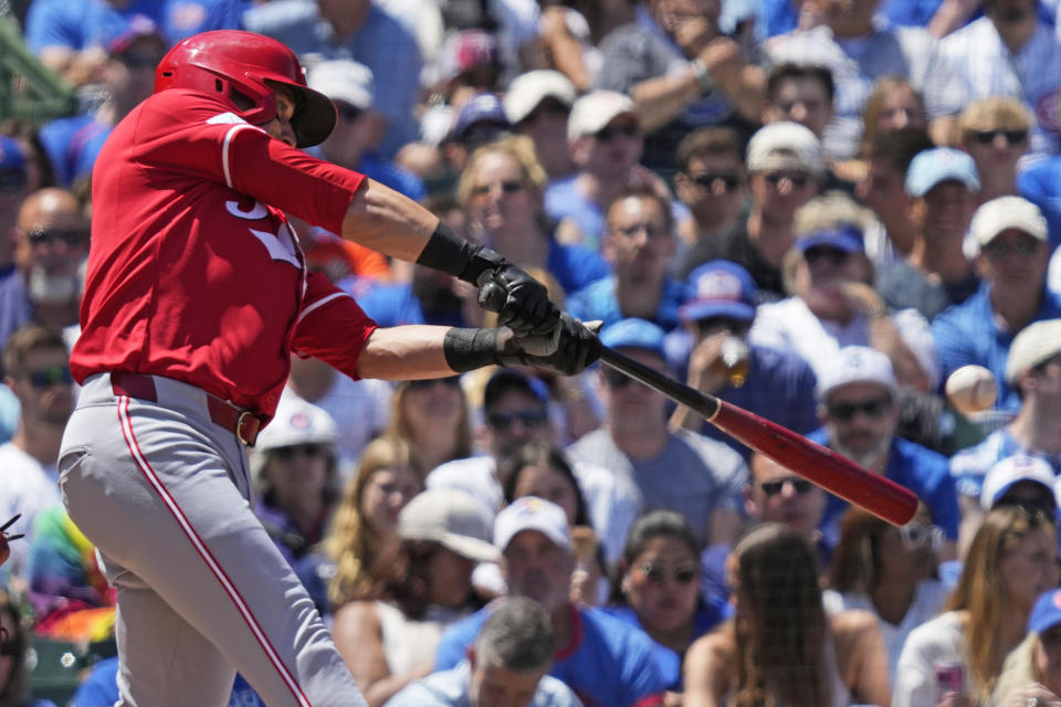 Cincinnati Reds' TJ Friedl hits a three-run home run during the second inning of a baseball game against the Chicago Cubs in Chicago, Sunday, June 2, 2024. (AP Photo/Nam Y. Huh)