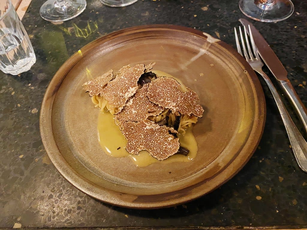 Tagliolini covered in a blanket of black truffle  (Molly Codyre)