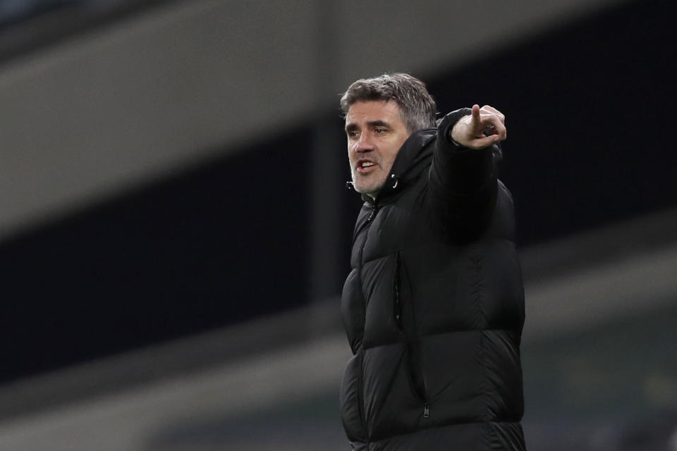 FILE - In this Thursday, March 11, 2021 file photo Dinamo Zagreb's manager Zoran Mamic gestures during the Europa League round of 16, first leg, soccer match between Tottenham Hotspur and Dinamo Zagreb at the Tottenham Hotspur Stadium in London, England. According to a statement late Monday March 15, 2021, Mamic has resigned after the Croatian supreme court confirmed his nearly five-year prison sentence for tax evasion and fraud, just days before a Europa League match against Tottenham.(AP photo/Alastair Grant, Pool, File)