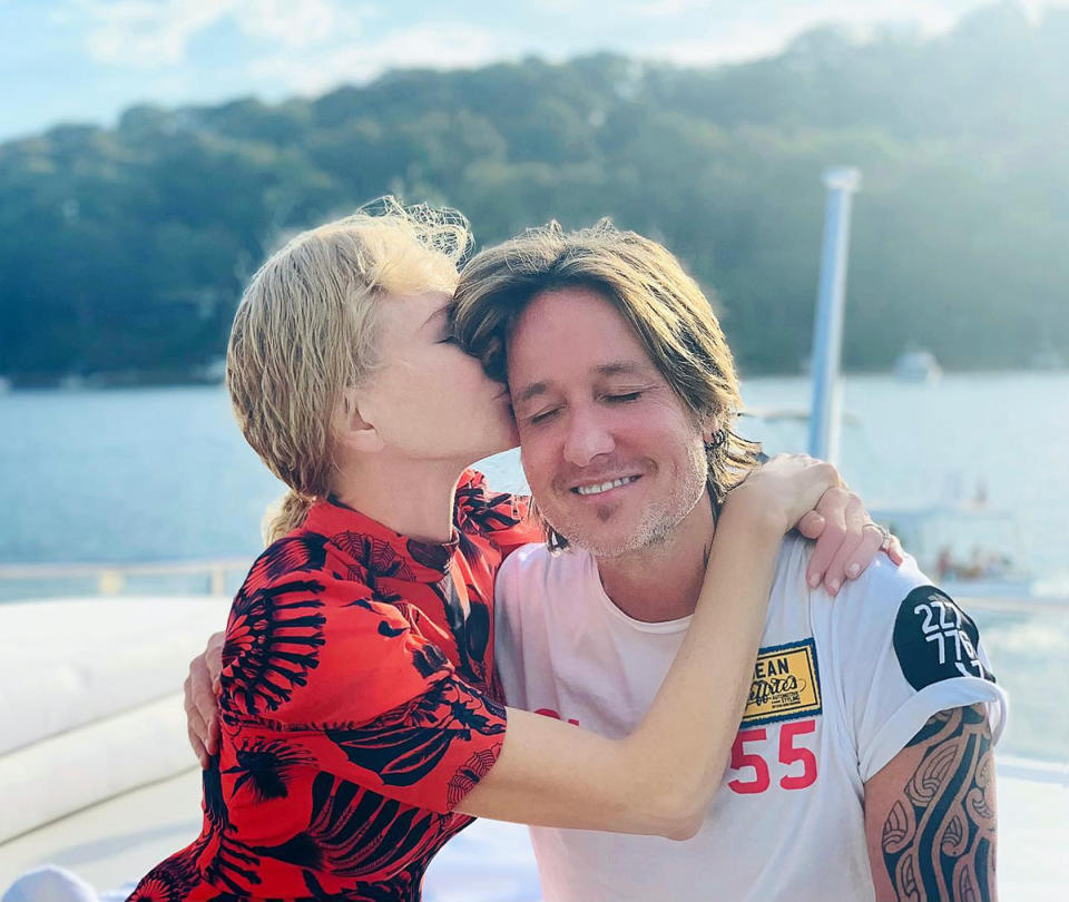 Nicole Kidman kisses Keith Urban on the forehead while by the water