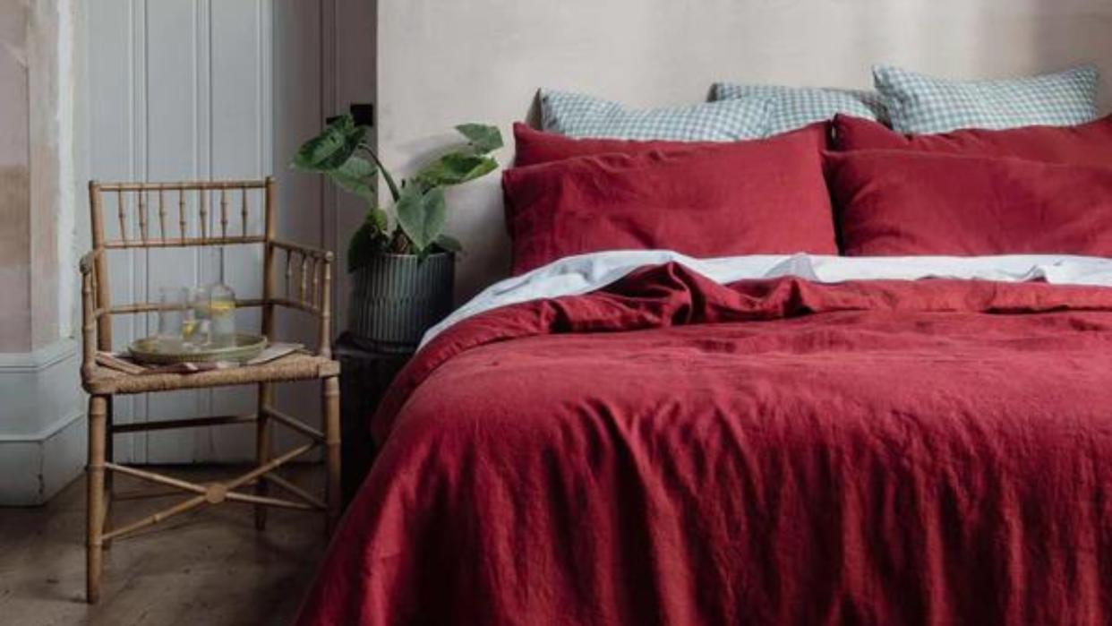  An example of the worst bed sheet colors - red bed sheets by Piglet in Bed  