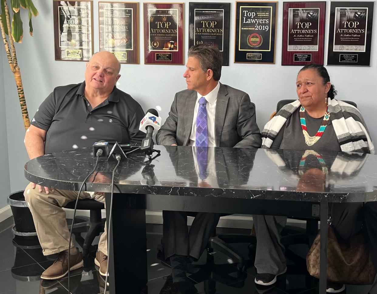 Bill Denley, from left, attorney Brad Gage and Mary Denley, speak during a news conference at Gage's office on Thursday, Feb. 22, 2024. The Denleys are suing Ventura County and the private health care provider Wellpath over the death of their daughter, Rose Denley.