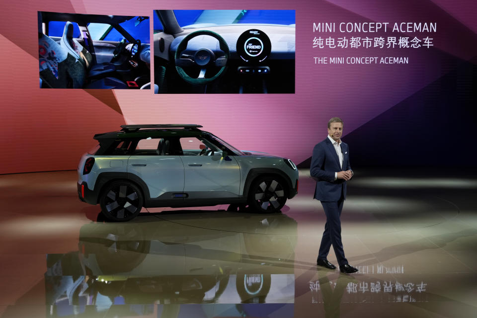 Oliver Zipse, chairman of the Board of Management of BMW AG, speaks as he unveils the new Mini Concept Aceman during the press day of the Auto Shanghai 2023 at the National Exhibition and Convention Center in Shanghai, China, Tuesday, April 18, 2023. Global and Chinese automakers plan to unveil more than a dozen new electric SUVs, sedans and muscle cars this week at the Shanghai auto show, their first full-scale sales event in four years in a market that has become a workshop for developing electrics, self-driving cars and other technology. (AP Photo/Ng Han Guan)