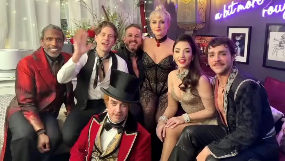 Cast members of Broadway's "Moulin Rouge" (with Tony-winning star Aaron Tveit waving) gather in a dressing room in an image from the video of Broadway shows supporting Michigan State University.