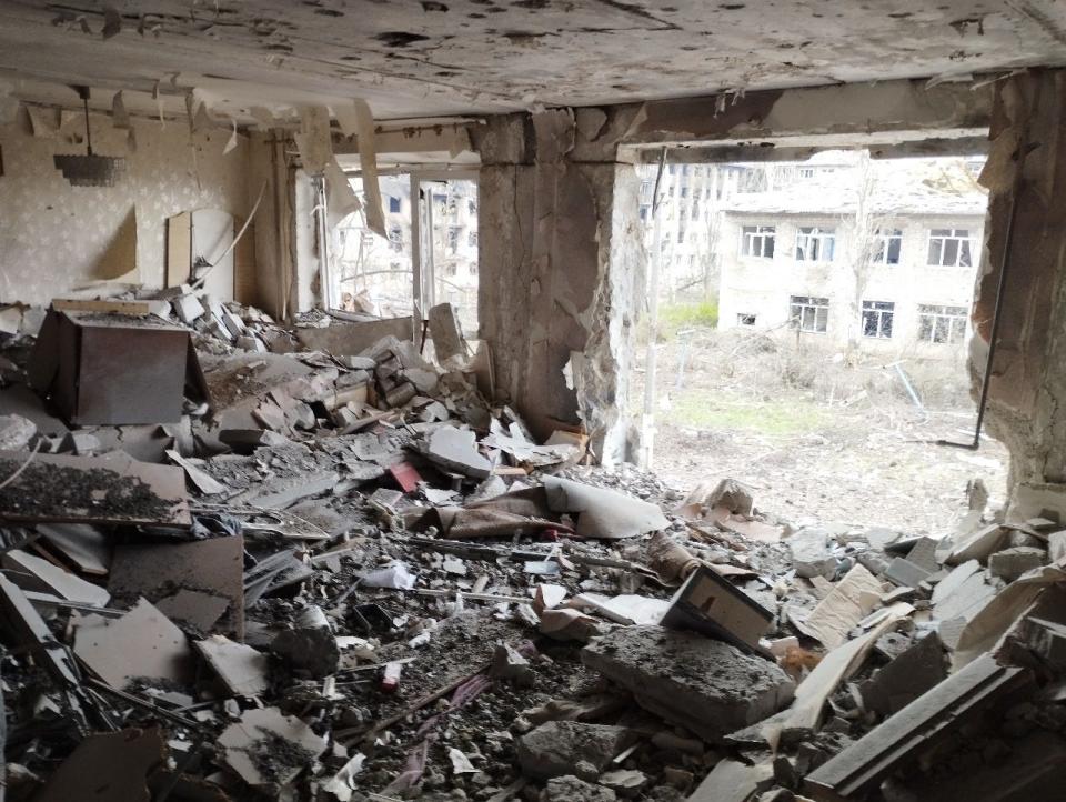 A view from inside the blasted ground floor of a building in Bakhmut.