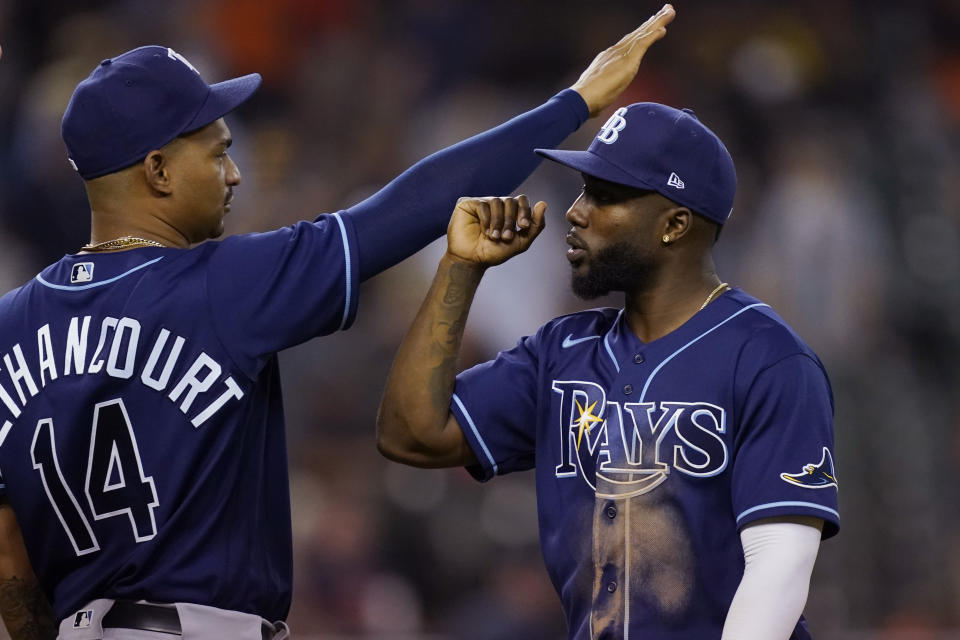 Tampa Bay Rays catcher Christian Bethancourt greets right fielder Randy Arozarena after the ninth inning of a baseball game against the Detroit Tigers, Friday, Aug. 5, 2022, in Detroit. (AP Photo/Carlos Osorio)