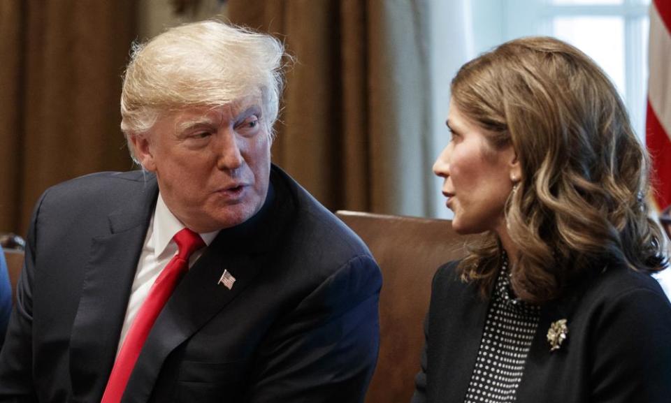 Then-president Donald Trump with Kristi Noem during a meeting at the White House in 2018