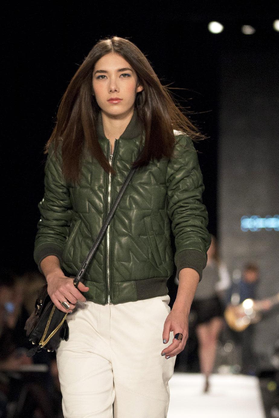 A model walks the runway during the Rebecca Minkoff Fall 2013 fashion show during Fashion Week, Friday, Feb. 8, 2013, in New York. (AP Photo/Karly Domb Sadof)