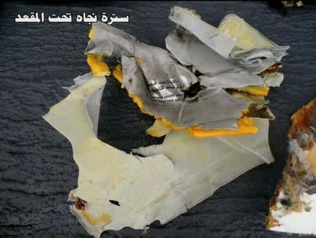 Recovered debris of the EgyptAir jet that crashed in the Mediterranean Sea is seen with the Arabic caption "life jacket under seat" in this still image taken from video on May 21, 2016. Egyptian Military/Handout via Reuters TV