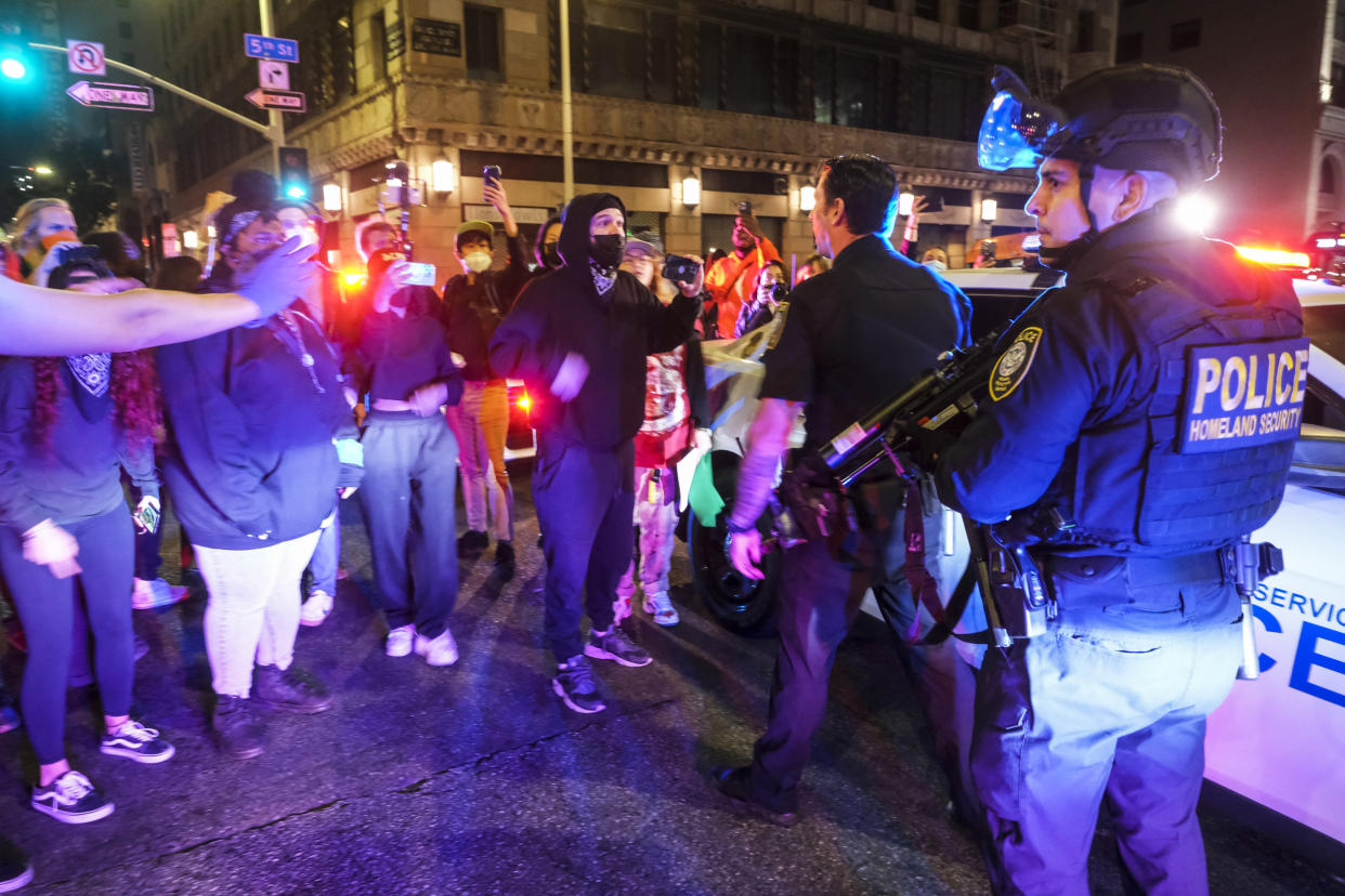 Demonstrators confront police officers (Ringo H.W. Chiu / AP)