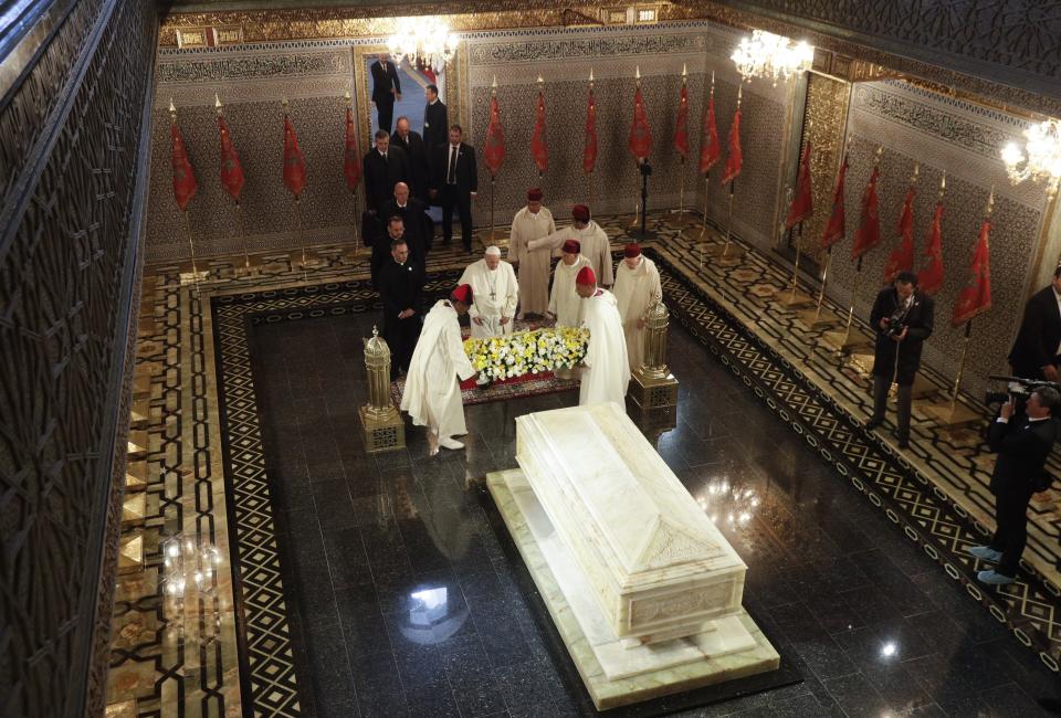 Pope Francis pays his homage to the Mausoleum of King Mohammed V, in Rabat, Morocco, Saturday, March 30, 2019. Francis's weekend trip to Morocco aims to highlight the North African nation's tradition of Christian-Muslim ties while also letting him show solidarity with migrants at Europe's door and tend to a tiny Catholic flock on the peripheries. (AP Photo/Gregorio Borgia)