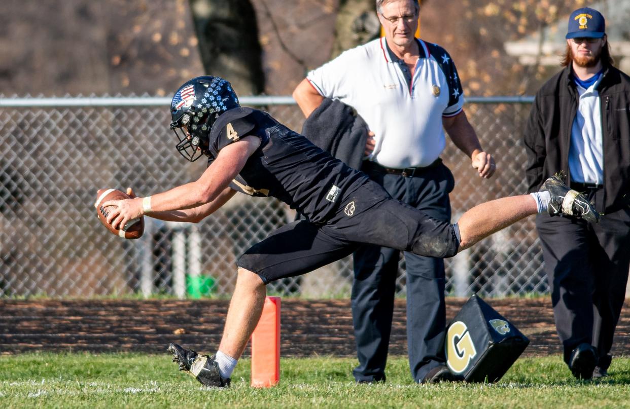 Lena-Winslow's Gage Dunker stretches for another touchdown during the third quarter of the Class 1A second-round playoff game on Saturday, Nov. 4, 2023, in Lena.