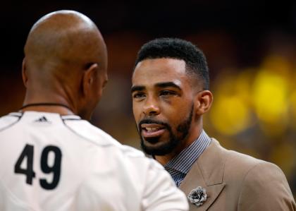 Mike Conley was on the Grizzlies' bench, but not available to play in Game 1 against the Warriors. (Getty Images)