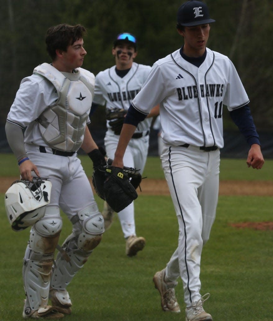 Exeter's Cam Keaveney (11) and catcher Finn Adams walk off the field after the fifth inning of Wednesday's Divison I game against rival Dover. Keaveney allowed one run on four hits, walked two and struck out seven in Exeter's 5-1 win.