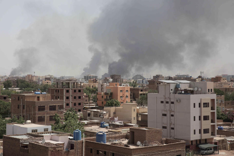 Smoke is seen rising from Khartoum's skyline, Sudan, Sunday, April 16, 2023. The Sudanese military and a powerful paramilitary group battled for control of the chaos-stricken nation for a second day Sunday, signaling they were unwilling to end hostilities despite mounting diplomatic pressure to cease fire. (AP Photo/Marwan Ali)